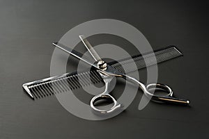 Hairdressing scissors on black background studio shot
