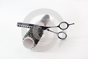 Hairdressing scissors and comb isolated