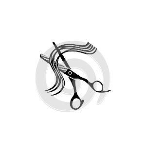 Hairdressing scissors and a lock of curly hair