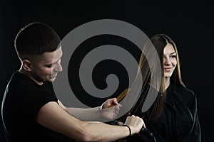 Hairdressing services. Hair styling process in a beauty salon