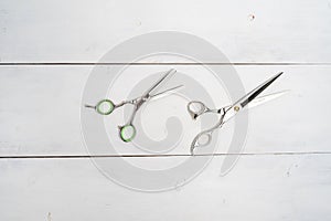 Hairdressing tools on a wooden background with copy space