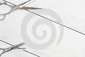 Hairdressing tools on a wooden background with copy space