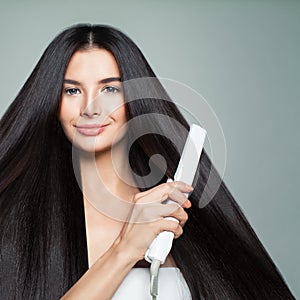 Hairdressing. Woman with Beautiful Long Straight Hair