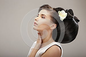 Hairstyle Contemporary Design. Sensual Woman with Creative Coiffure. Glamor photo