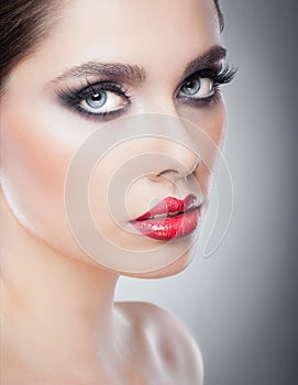 Hairstyle and Make up - beautiful female art portrait with beautiful eyes. Elegance. Genuine Natural brunette in studio