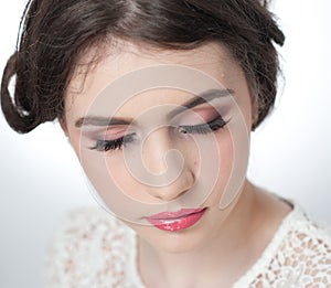 Hairstyle and make up - beautiful young girl art portrait with closed eyes. Genuine natural brunette, studio shot