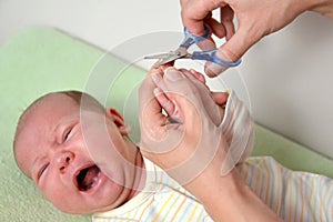 Hairstyle of nails on hands at the baby