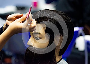 Hairstyles on dummy head of hair salon