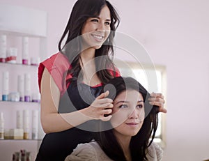 Hairstylist adding the finishing touches photo