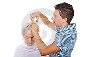 Hairstylist cut woman hair photo