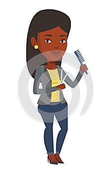 Hairstylist holding comb and scissors in hands.