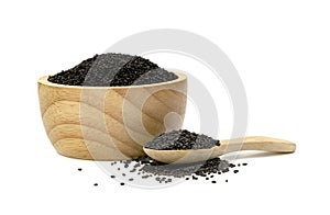 Hairy basil seeds with wooden bowl and spoon isolated on white background