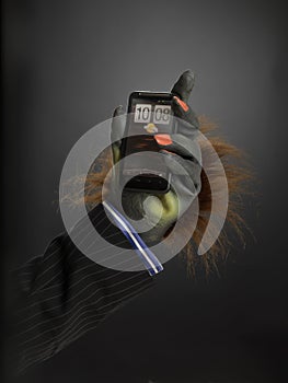 Hairy hand holding cell phone