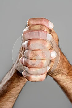 Hairy man hand closeup expression over gray