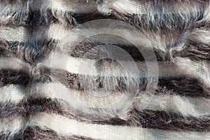 hairy woolen textile as fabric texture background