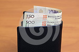 Haitian gourde in the black wallet