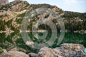 Haiyaha Lake Reflects The Mountainside Trees