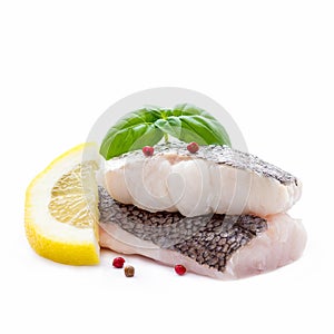 Hake fillet with skin and lemon, isolated photo