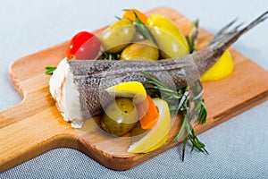 Hake by rustically, frying and served with boiled potatoes, carrots and greens