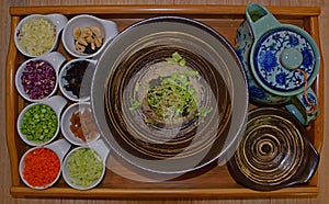 Hakka Tea Rice (Lei Cha) served on wooden tray photo
