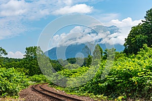 Hakodate main line railroad at Town Niseko in springtime sunny day photo
