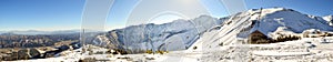 Hakuba mountain range in the afternoon on a clear sunny day. The very steep area directly beneath the sunshine is between two ski