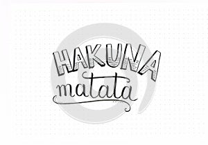 `Hakuna Matata` hand lettering in black and white with brush pen