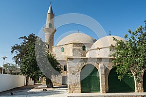 Hala Sultan Tekke or the Mosque of Umm Haram near with palm tree, a mosque and tekke complex on the west bank of Larnaca Salt Lake