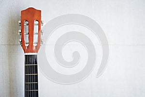 Half acoustic guitar on white background with right free space