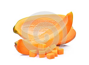 Half adn slice of fresh papaya with cubes isolated on white