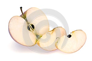 Half Apple and Slices on White