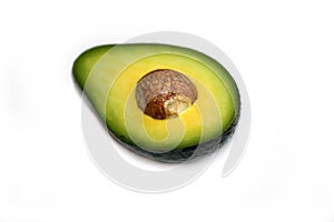 Half avocado with seed isolated.