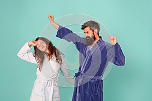 Half awake. Couple in love look sleepy in morning. Sleepy woman and hipster stretch and yawn blue background. Early
