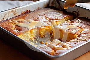 half-baked cake with gooey center in a baking tray