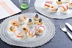 Half boiled eggs stuffed with fillings