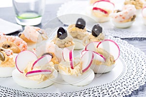 Half boiled eggs stuffed with fillings