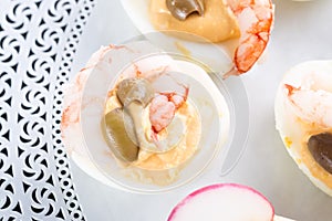 Half boiled eggs stuffed with fillings