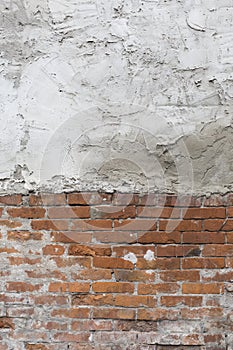 half brick wall half plaster background