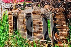 Half burnt wooden house in shanties