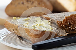 Half a Buttered Ciabatta Bread Roll.