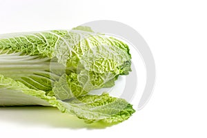 Half of the Chinese cabbage is isolated on white background with a clipping path, side view, space for text