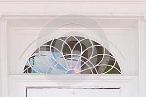 Half circle white transom window