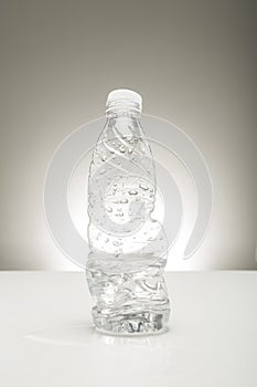 Half consumed bottle of water photo