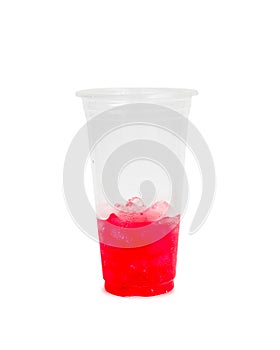 Half of cool red soda water in plastic glass isolated on white b