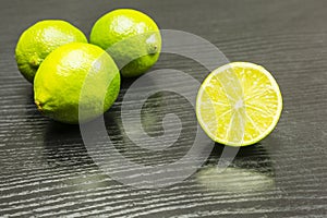 Half cut lime fruit on the table.