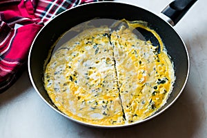 Half Cut Omelette with Cream Cheese and Chives in Pan.