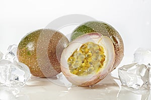 Half cut  passion fruit with ais isolated on white. photo