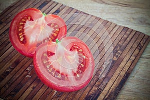 Half cut of red tomato in heart shape