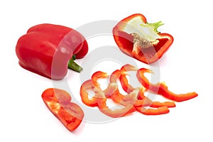 Half cut and sliced fresh red sweet ripe bell pepper isolated