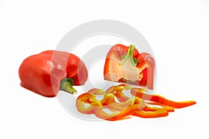 Half cut and sliced fresh red sweet ripe bell pepper isolated